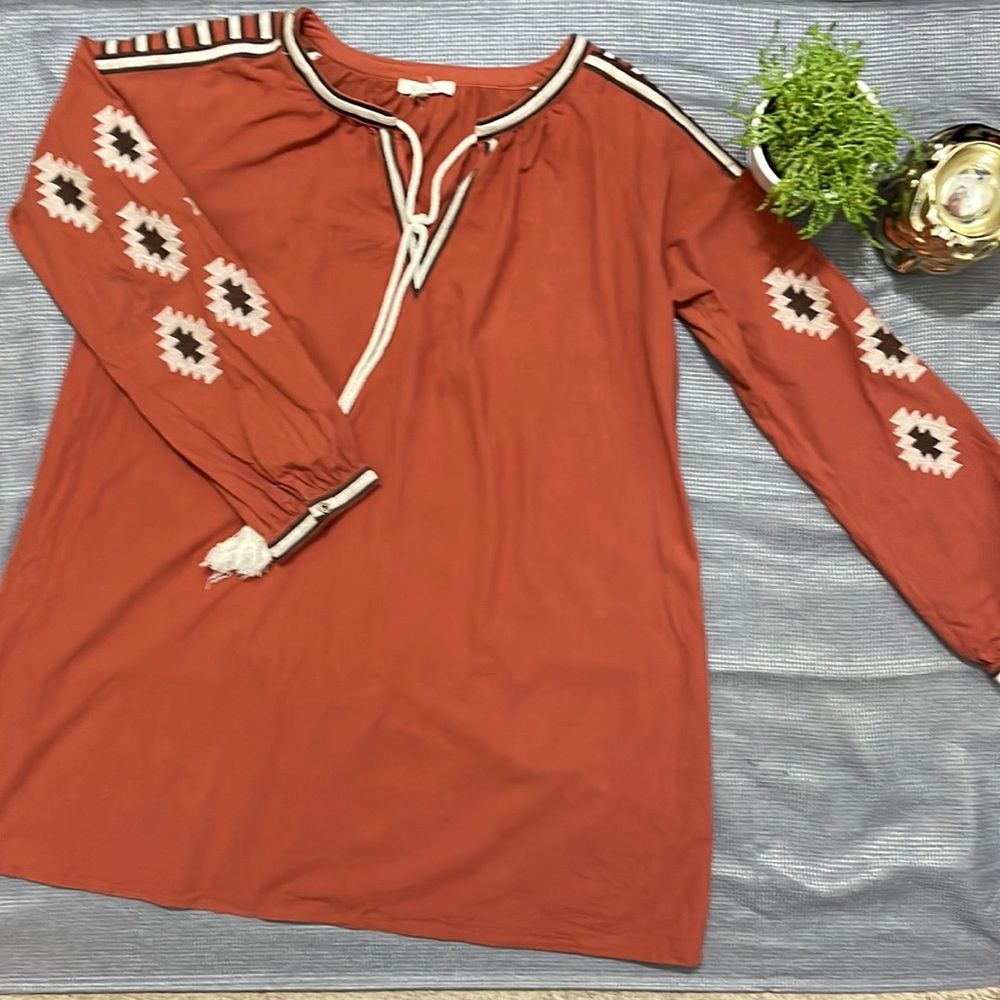 Size large 100% cotton .   Earth toned